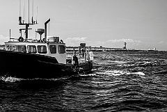 Fishing Boat with Straitsmouth Light in the Background -BW
